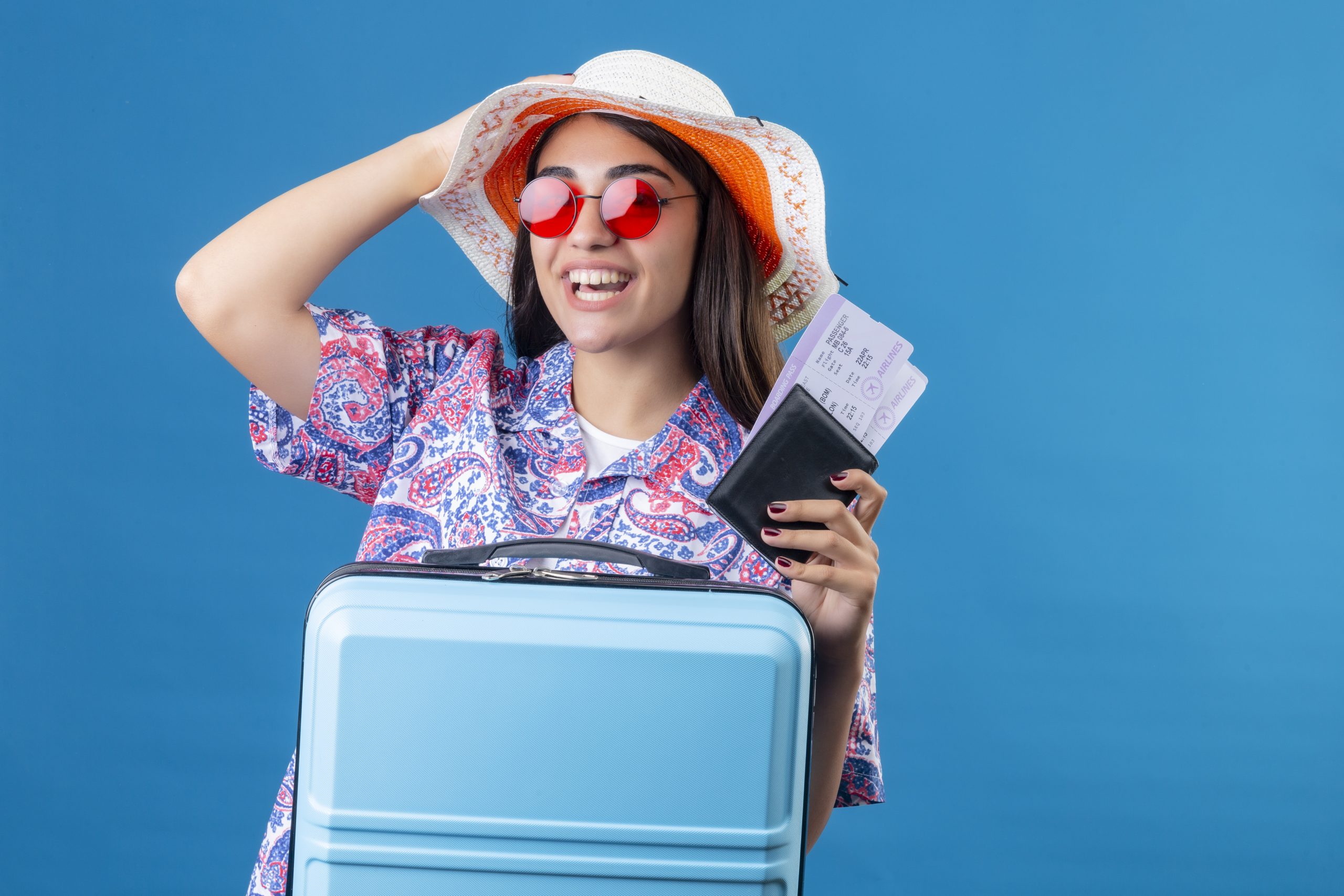tourist-woman-with-hat-wearing-red-sunglasses-holding-travel-suitcase-passport-with-tickets-with-smi.jpeg